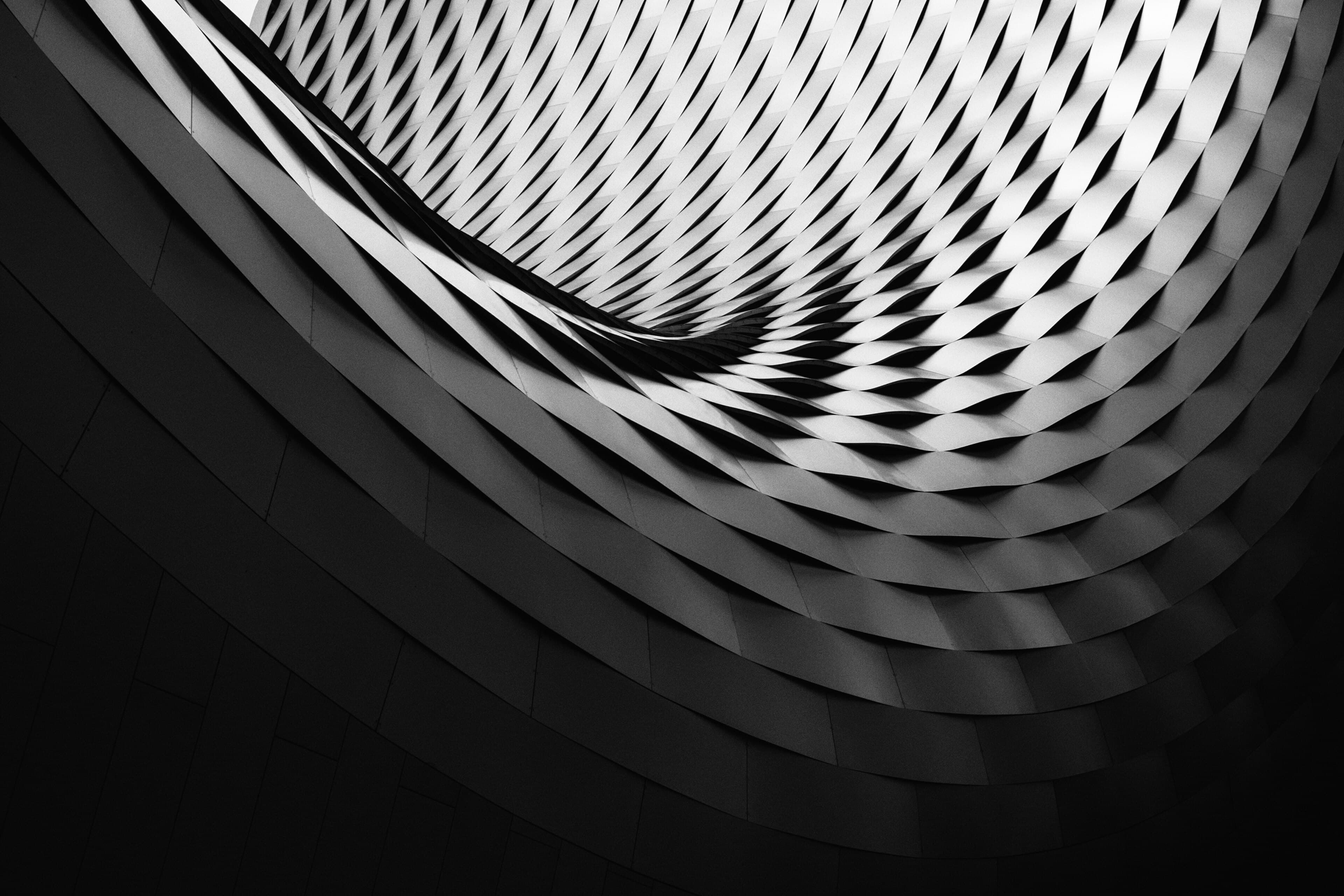Monochrome architectural spiral used as a decorative premium accent.